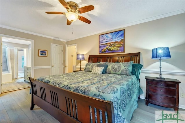 bedroom featuring crown molding, ceiling fan, and light hardwood / wood-style flooring