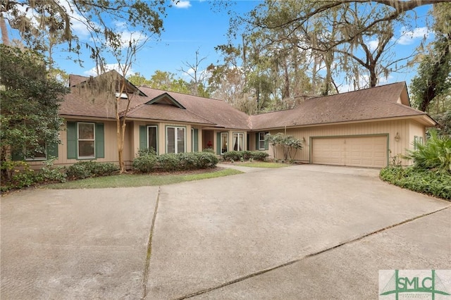 ranch-style home featuring a garage