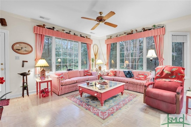 interior space with crown molding, parquet floors, and ceiling fan