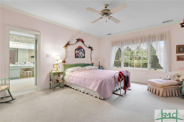 carpeted bedroom featuring crown molding and ceiling fan