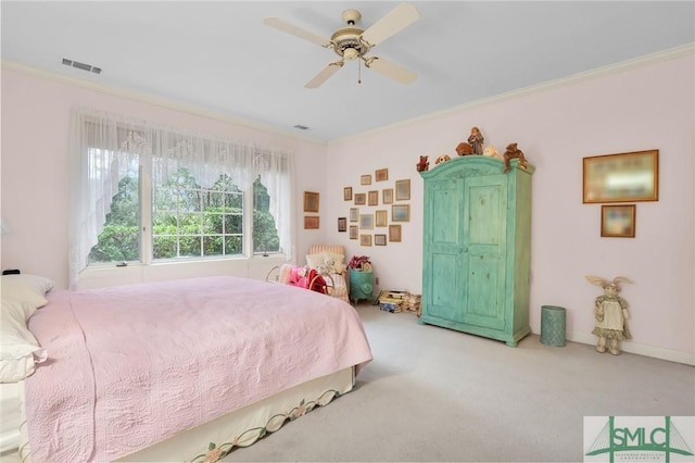 bedroom featuring ornamental molding, carpet flooring, and ceiling fan