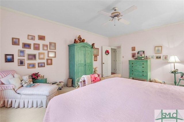 bedroom featuring crown molding, carpet floors, and ceiling fan