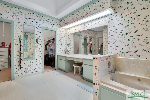 bathroom with a bathing tub and vanity