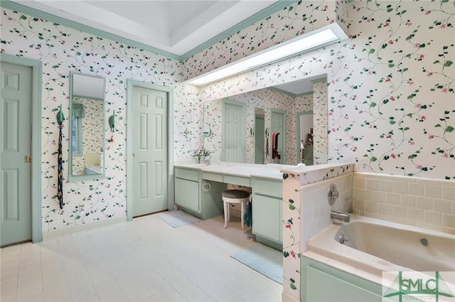 bathroom featuring vanity and a tub