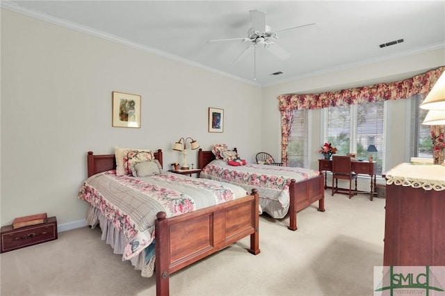 bedroom with ornamental molding, light carpet, and ceiling fan