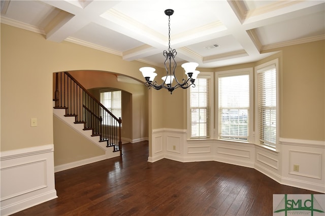 unfurnished dining area featuring beam ceiling, crown molding, a healthy amount of sunlight, and dark hardwood / wood-style flooring