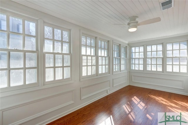 unfurnished sunroom with wooden ceiling and ceiling fan