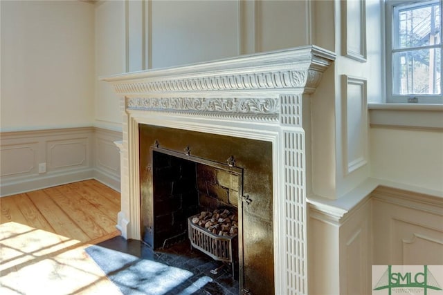 details with a fireplace and hardwood / wood-style floors