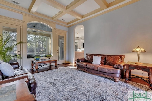 living room with beamed ceiling, crown molding, coffered ceiling, and hardwood / wood-style floors