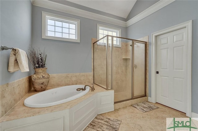 bathroom featuring vaulted ceiling and independent shower and bath