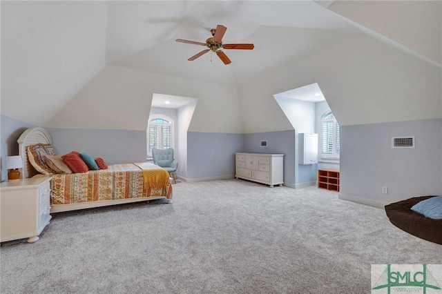 carpeted bedroom with vaulted ceiling and ceiling fan