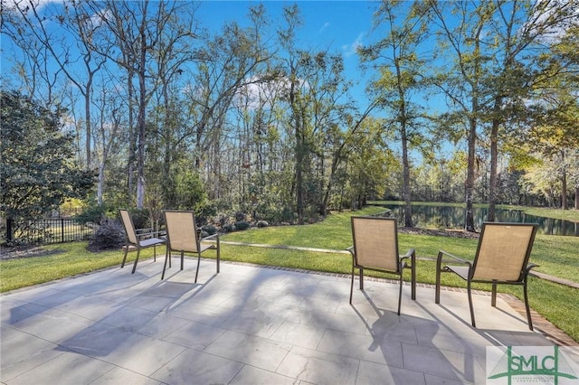 view of patio with a water view