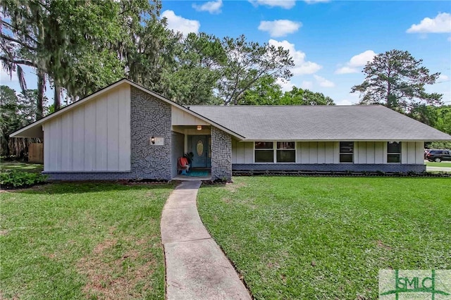 ranch-style home with a front lawn