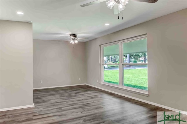 empty room featuring dark hardwood / wood-style floors and ceiling fan