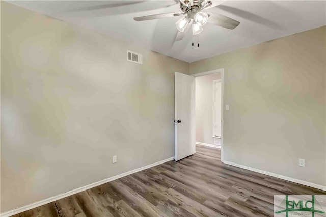 unfurnished room with hardwood / wood-style flooring and ceiling fan