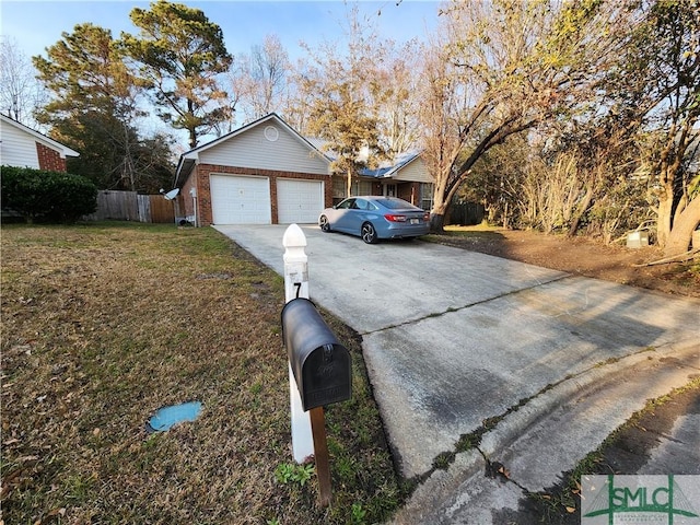 exterior space with a garage and a front yard