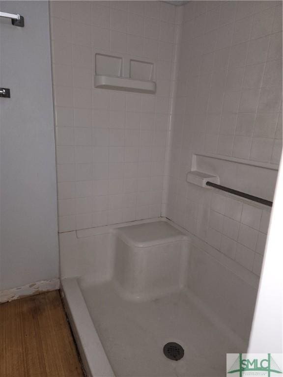 bathroom featuring hardwood / wood-style floors and a shower