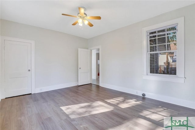 unfurnished room featuring wood-type flooring and ceiling fan