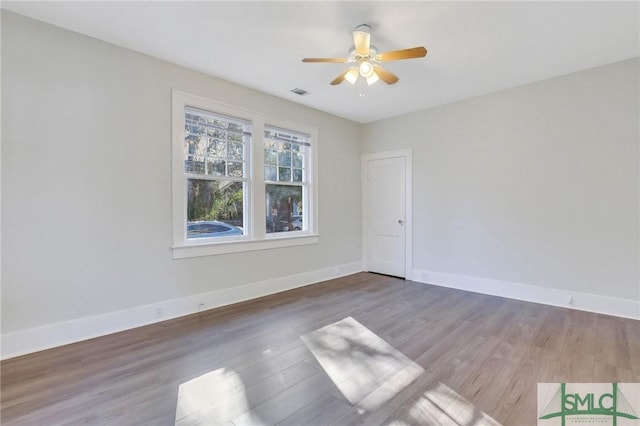 empty room with wood-type flooring and ceiling fan