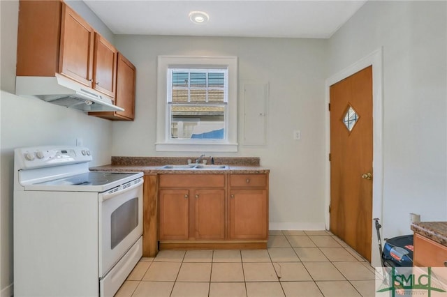 kitchen featuring light tile patterned flooring, sink, and white electric range