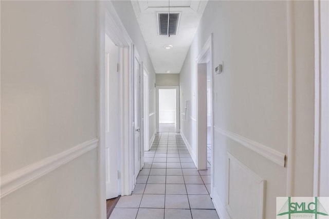 hallway with light tile patterned floors