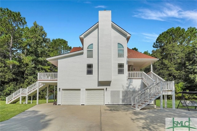 back of house with a garage