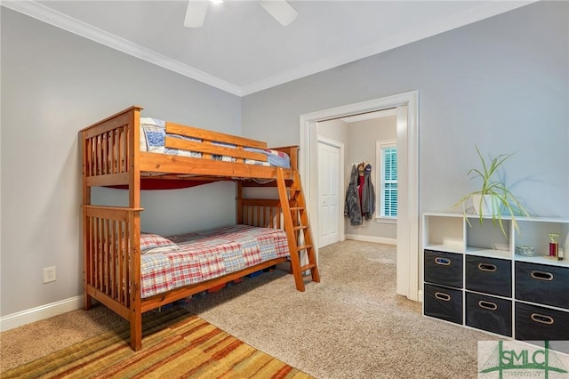 bedroom with ornamental molding, carpet flooring, and ceiling fan