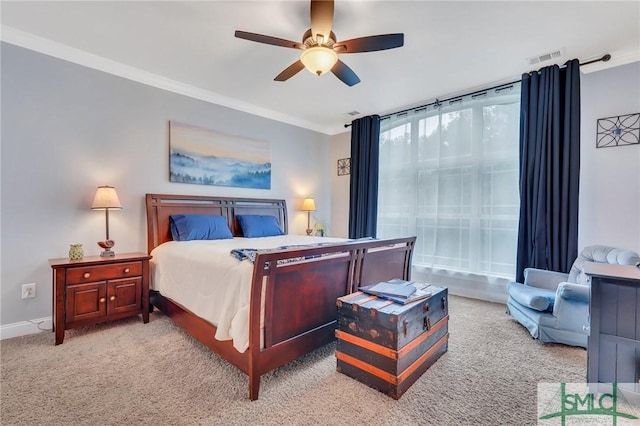 bedroom with crown molding, ceiling fan, and light colored carpet