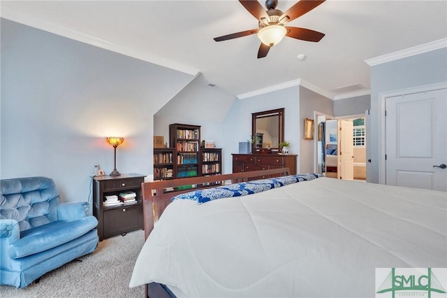 carpeted bedroom featuring crown molding, ceiling fan, and ensuite bath