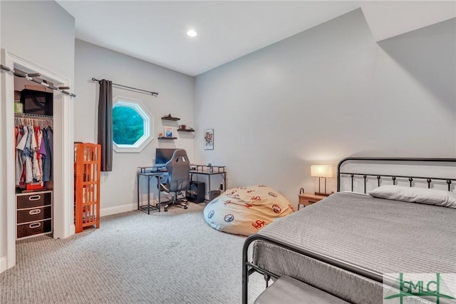 bedroom with light colored carpet and a closet