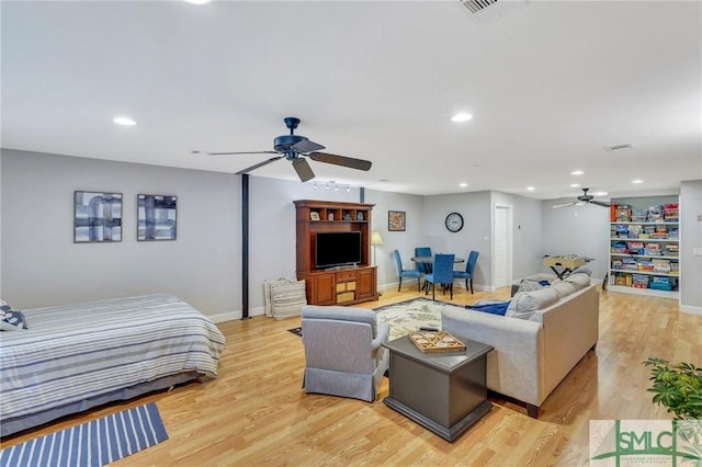 bedroom featuring ceiling fan and light hardwood / wood-style flooring