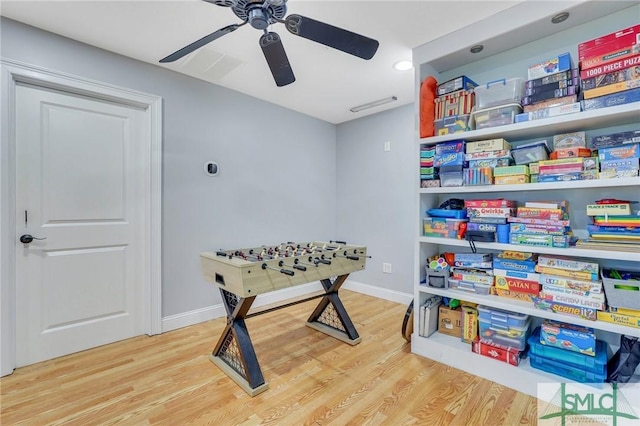 playroom featuring wood-type flooring and ceiling fan