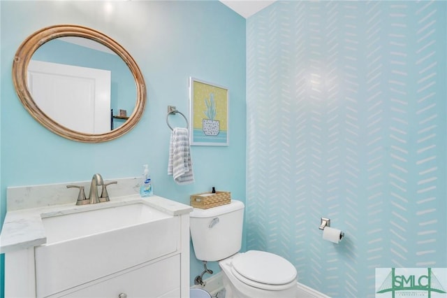 bathroom with vanity and toilet