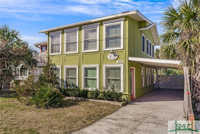 view of side of home featuring a carport