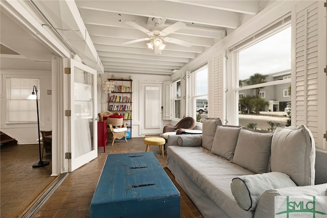 sunroom / solarium featuring vaulted ceiling with beams and ceiling fan