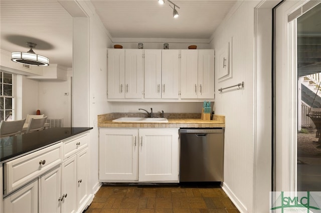 kitchen with dishwasher, sink, and white cabinets