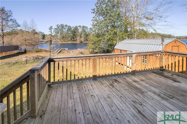 wooden deck featuring a water view