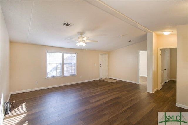 unfurnished room with ceiling fan, lofted ceiling, and dark hardwood / wood-style flooring