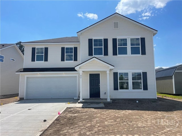 82 Marsh Salt Ln, Port Wentworth, GA 31407 - view of front facade with concrete driveway and a garage