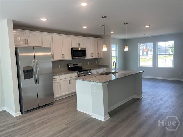 82 Marsh Salt Ln, Port Wentworth, GA 31407 - kitchen with appliances with stainless steel finishes, a sink, white cabinets, baseboards, and wood finished floors