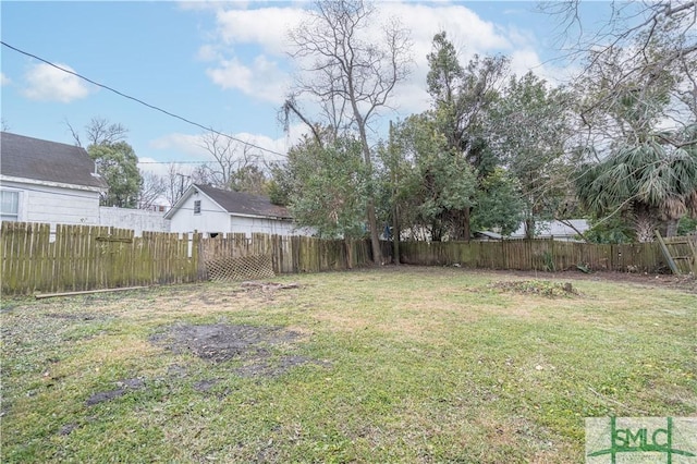 view of yard with a fenced backyard