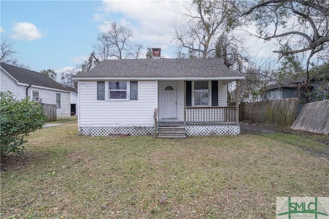 view of front of home featuring covered porch and a front lawn