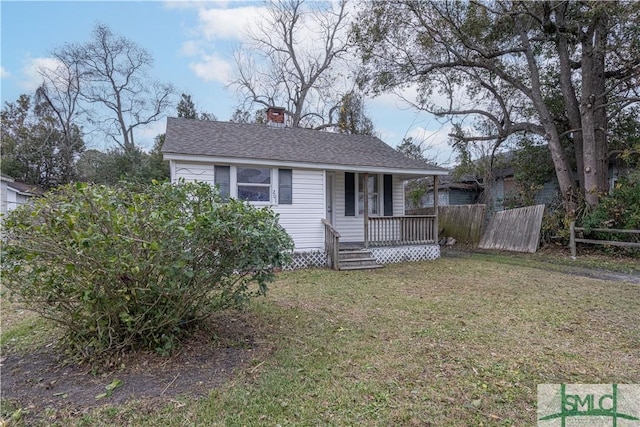 view of front of home featuring a front yard and a porch