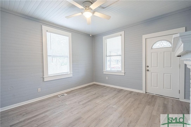 entryway with ceiling fan, a healthy amount of sunlight, and light wood-type flooring