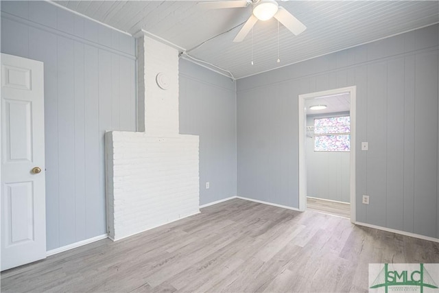 spare room featuring ceiling fan and light hardwood / wood-style floors