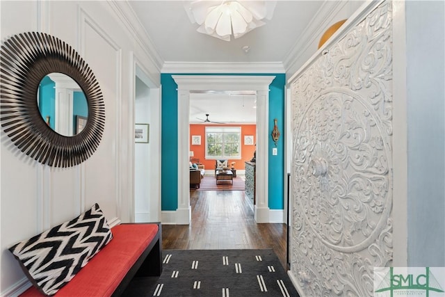 hallway featuring dark wood-type flooring and ornamental molding