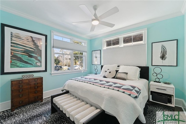 carpeted bedroom featuring ornamental molding and ceiling fan