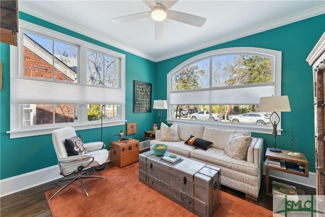 sitting room with ornamental molding, wood-type flooring, a healthy amount of sunlight, and ceiling fan