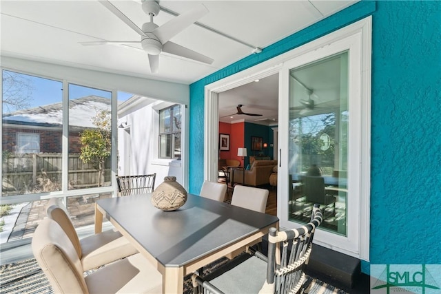 sunroom / solarium with ceiling fan