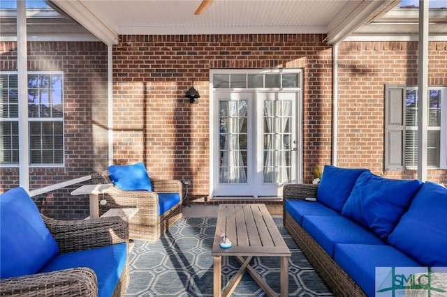 view of patio / terrace with outdoor lounge area, ceiling fan, and french doors